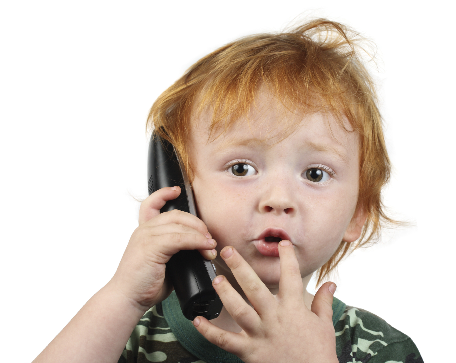 Red haired boy talking on the phone